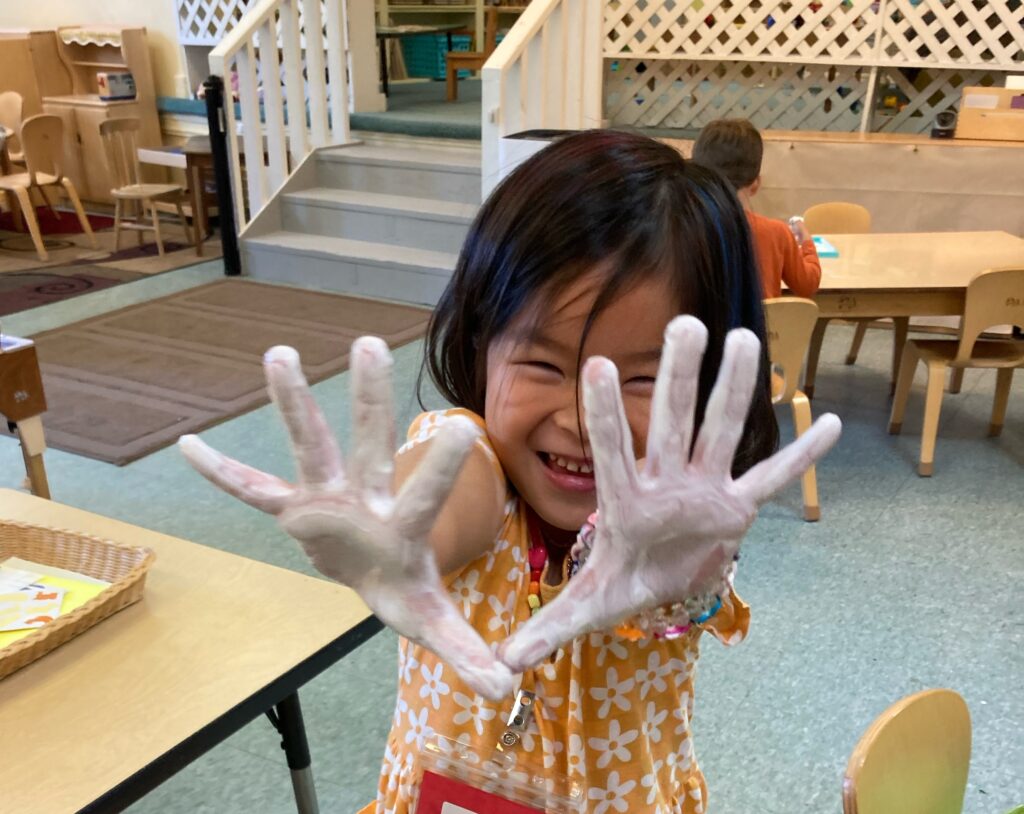 Girl with messy hands playing